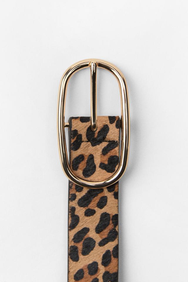 Belt made of printed leather with a width of 1.2 inches (3 cm). Oval metal buckle. Product Image