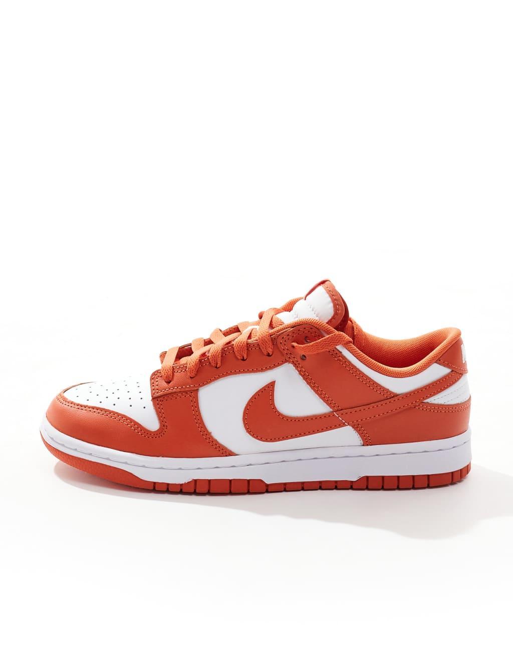 Nike Dunk Low Retro sneakers in white and orange Product Image