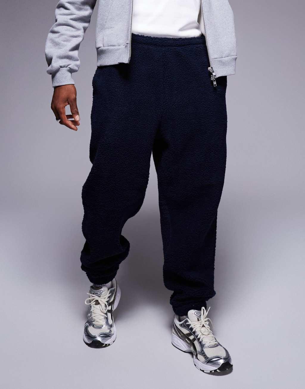 ASOS DESIGN oversized borg sweatpants in navy Product Image