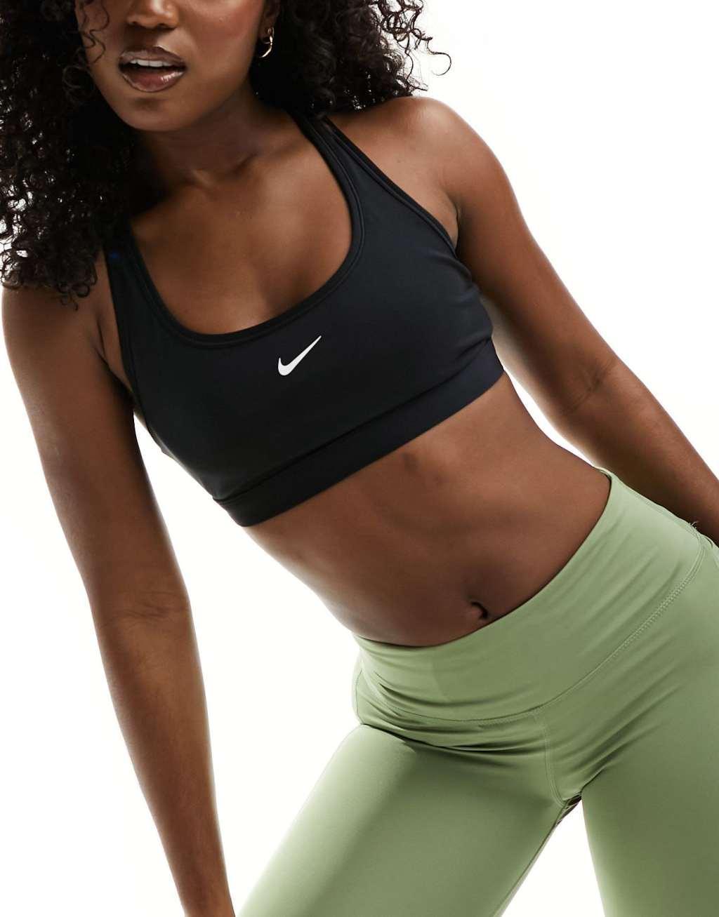 Nike Training Swoosh light support sports bra in black Product Image