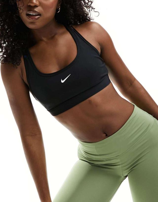 Nike Training Swoosh light support sports bra in black Product Image