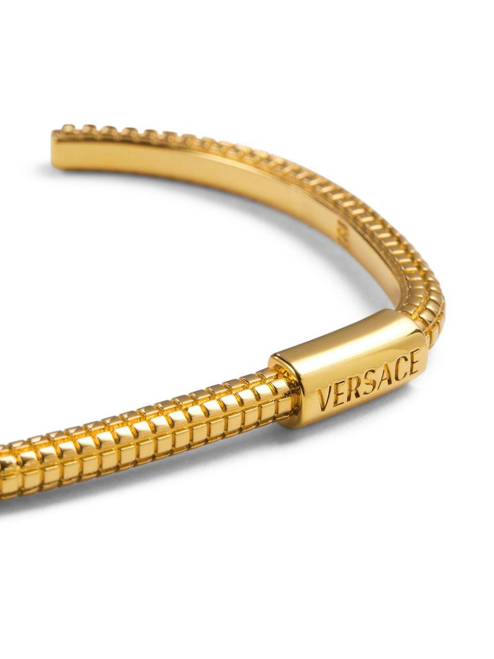 VERSACE Engraved Logo Waffle Texture Cuff In Gold Product Image