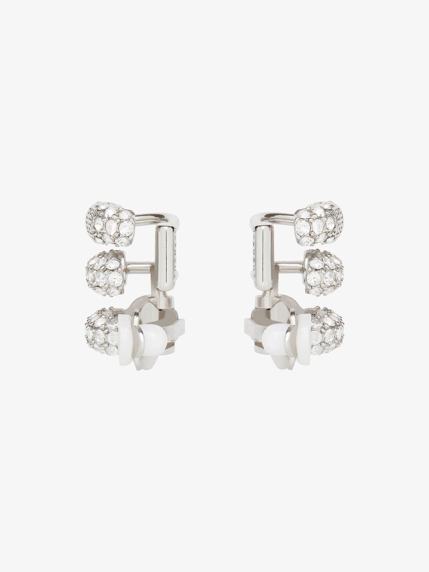 Stitch clip earrings in metal with crystals Product Image