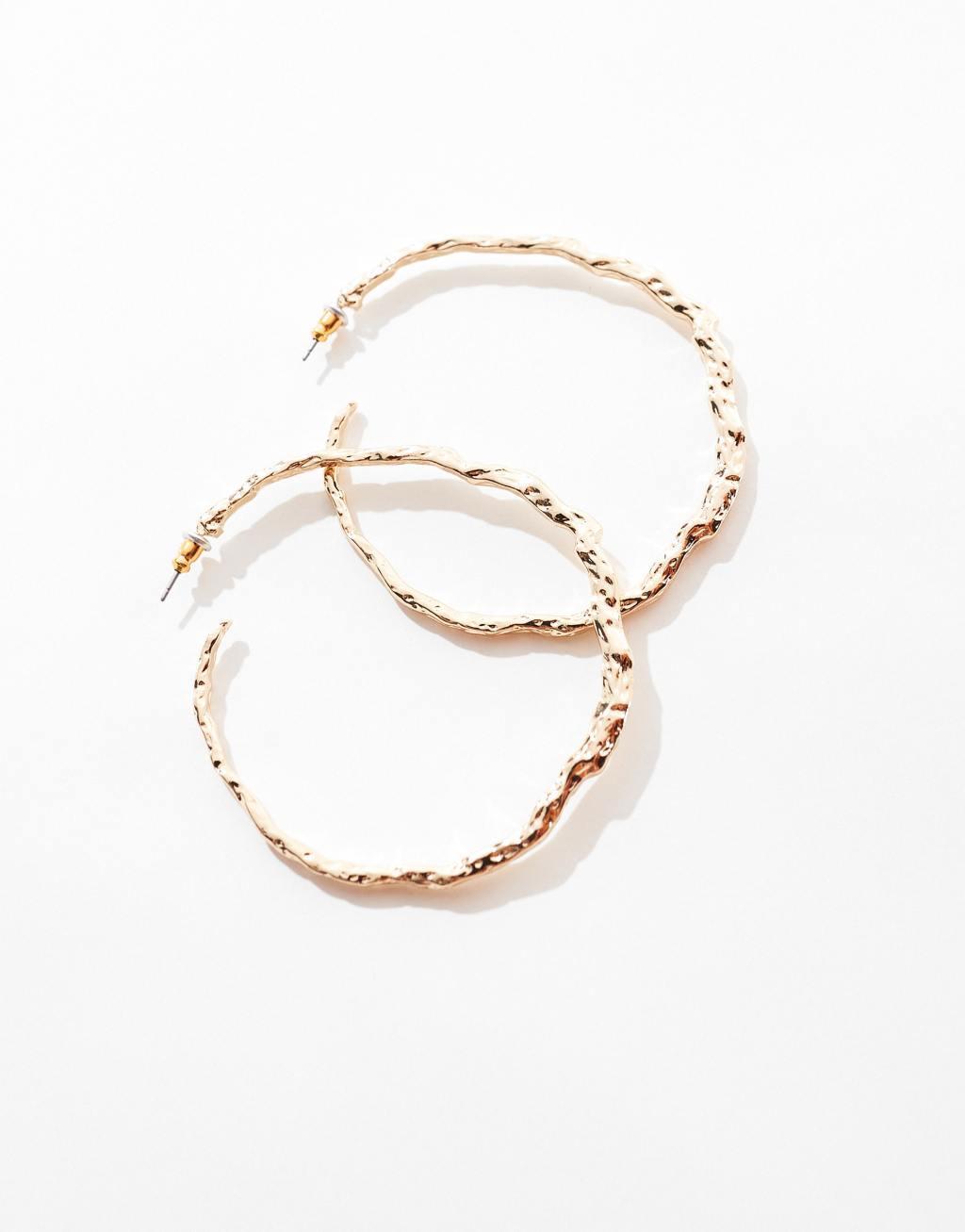 ASOS DESIGN hoop earrings with textured molten detail in gold tone Product Image