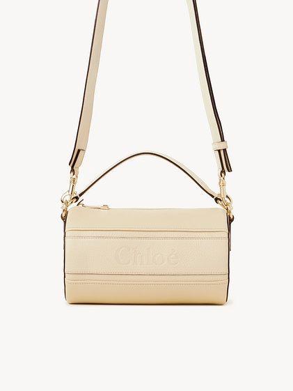 Woody tube shoulder bag in grained leather Product Image