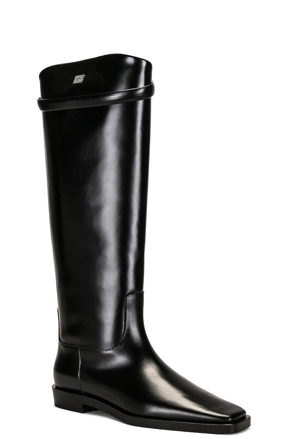 Toteme The Riding Boot in Black - Black. Size 35 (also in 36, 40, 41). Product Image