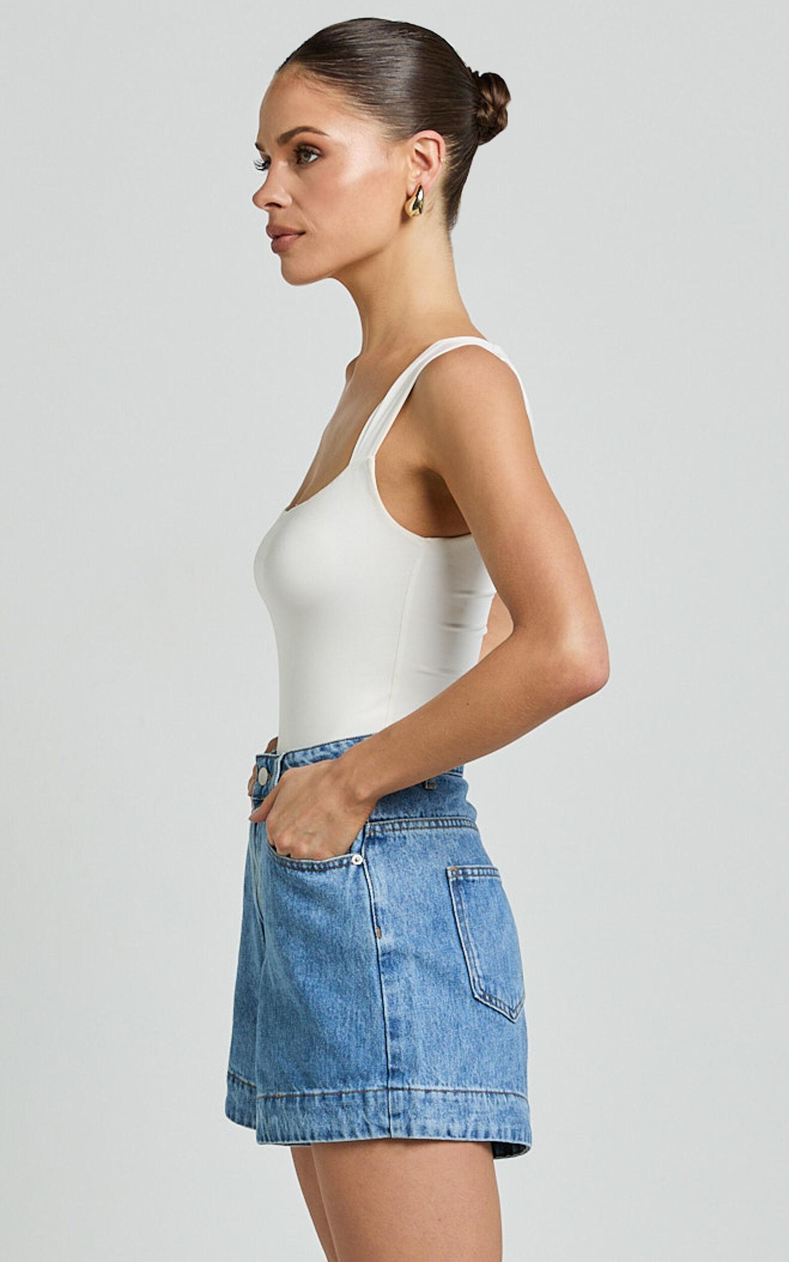 Rhianna Shorts - Mid Waist Recycled Denim Shorts in Mid Blue Wash Product Image