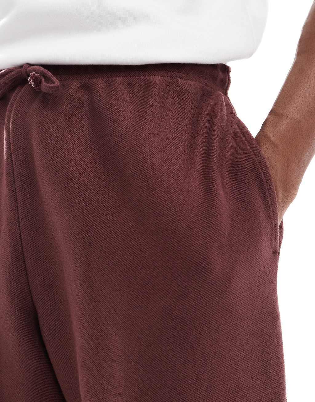 ASOS DESIGN oversized textured sweatpants in burgundy Product Image