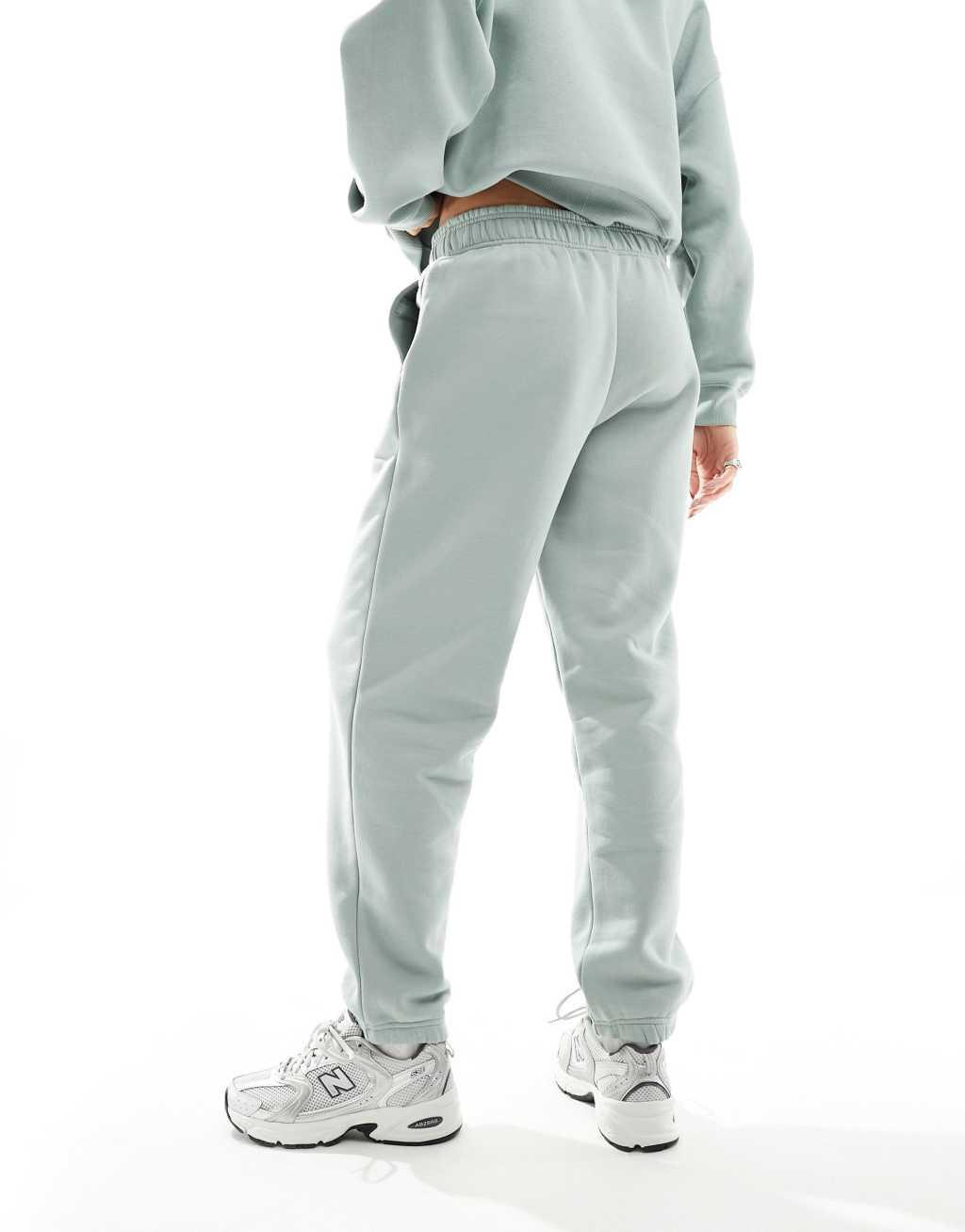 New Balance Linear Heritage brushed back track pants in light green Product Image