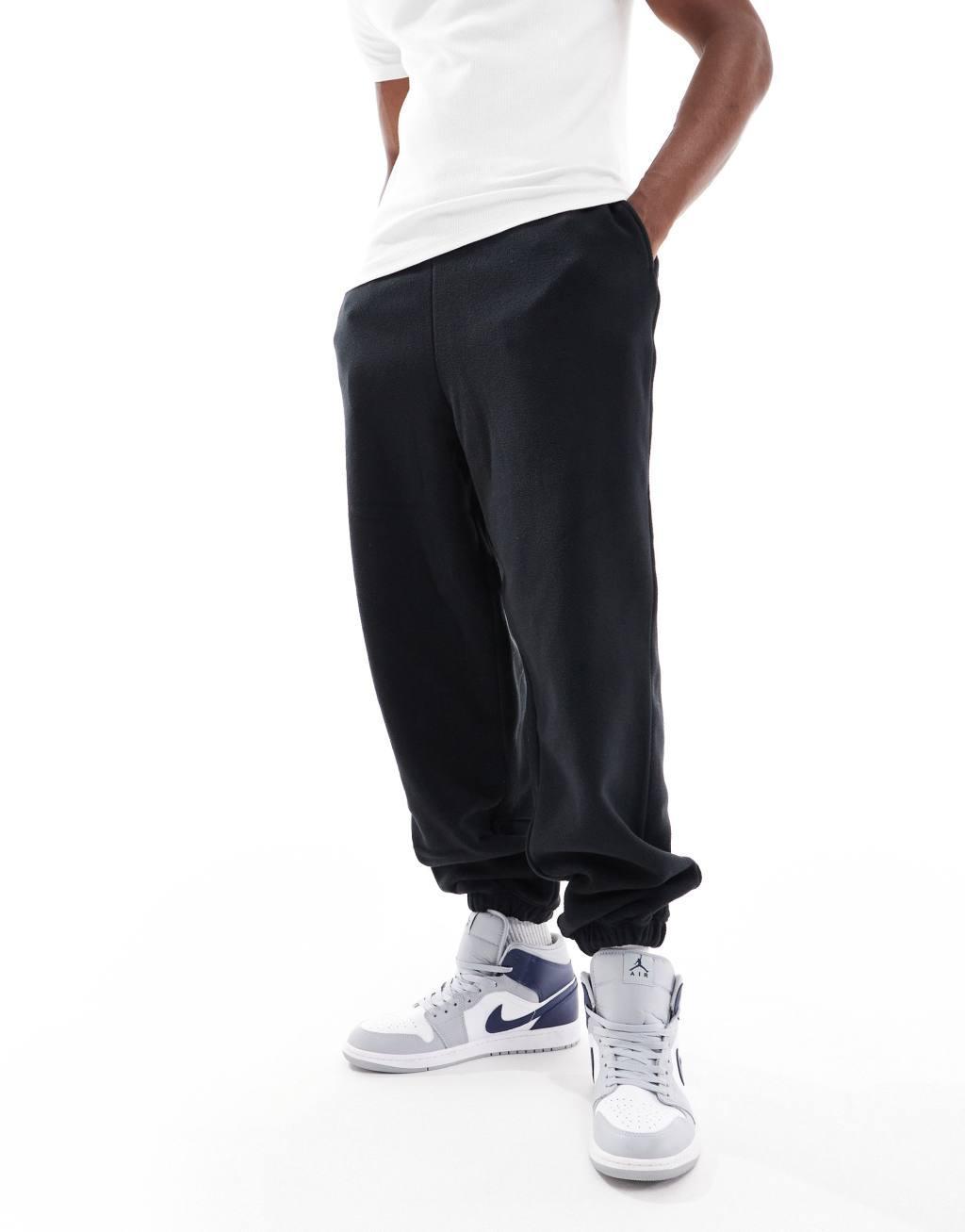 ASOS DESIGN oversized fleece sweatpants in black Product Image