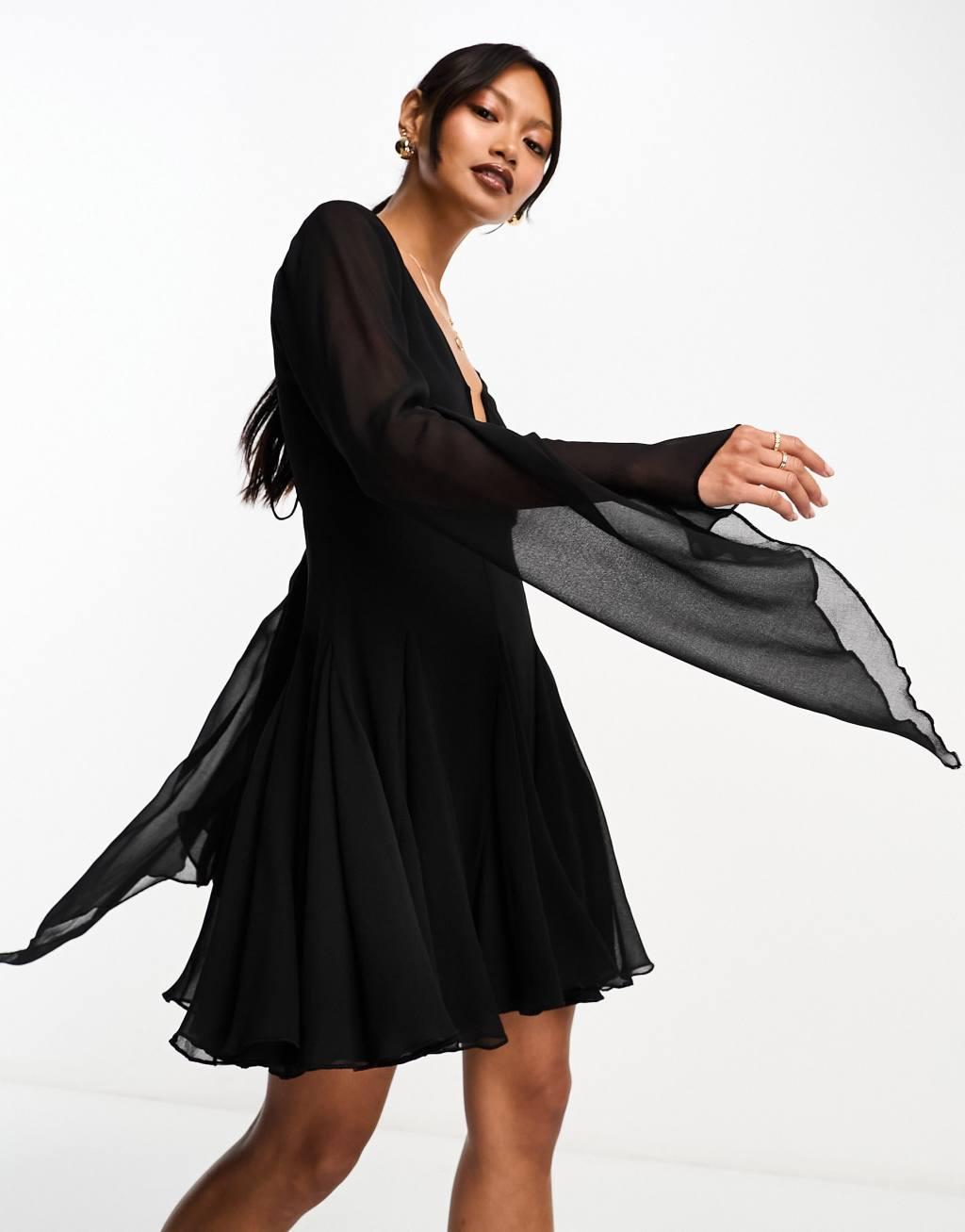 ASOS DESIGN mini dress with godet and asymmetric sleeve detail in black Product Image