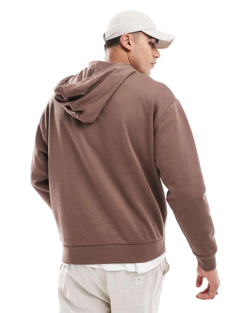 ASOS DESIGN oversized sweatshirt with chest applique in brown Product Image