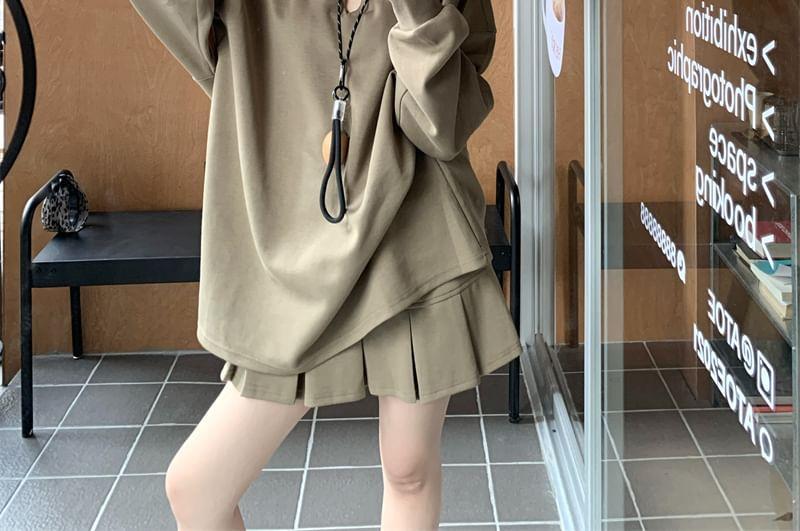 Notch Neck Plain Oversized Sweatshirt / High Waist Pleated Mini A-Line Skirt Product Image