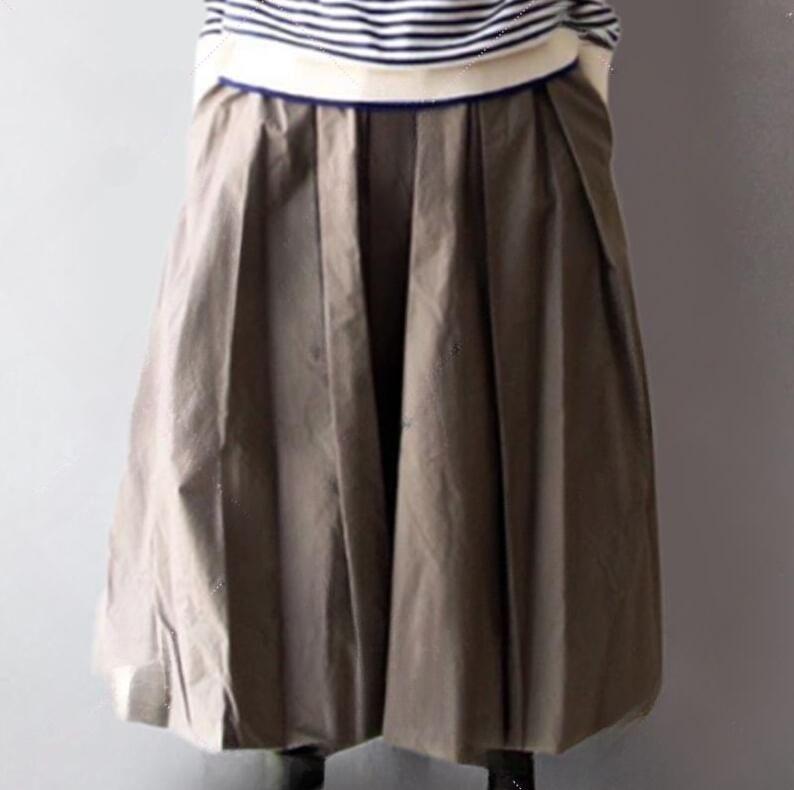 Set: Long Sleeve Turtleneck Striped Top + Elastic Waist Plain Pleated Maxi A-Line Skirt Product Image