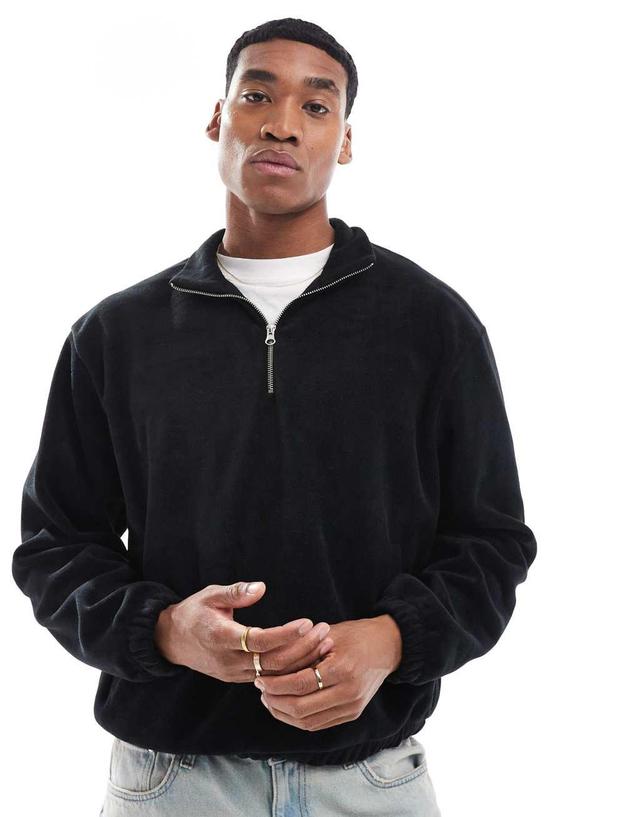 ASOS DESIGN boxy oversized fleece sweatshirt with half zip and elasticated hem in black Product Image