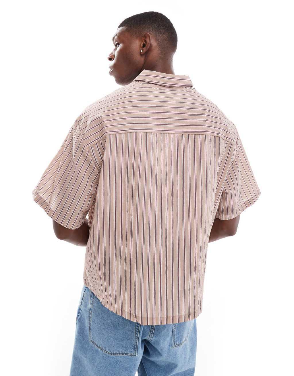 ASOS DESIGN boxy oversized shirt with textured stripes in pink Product Image