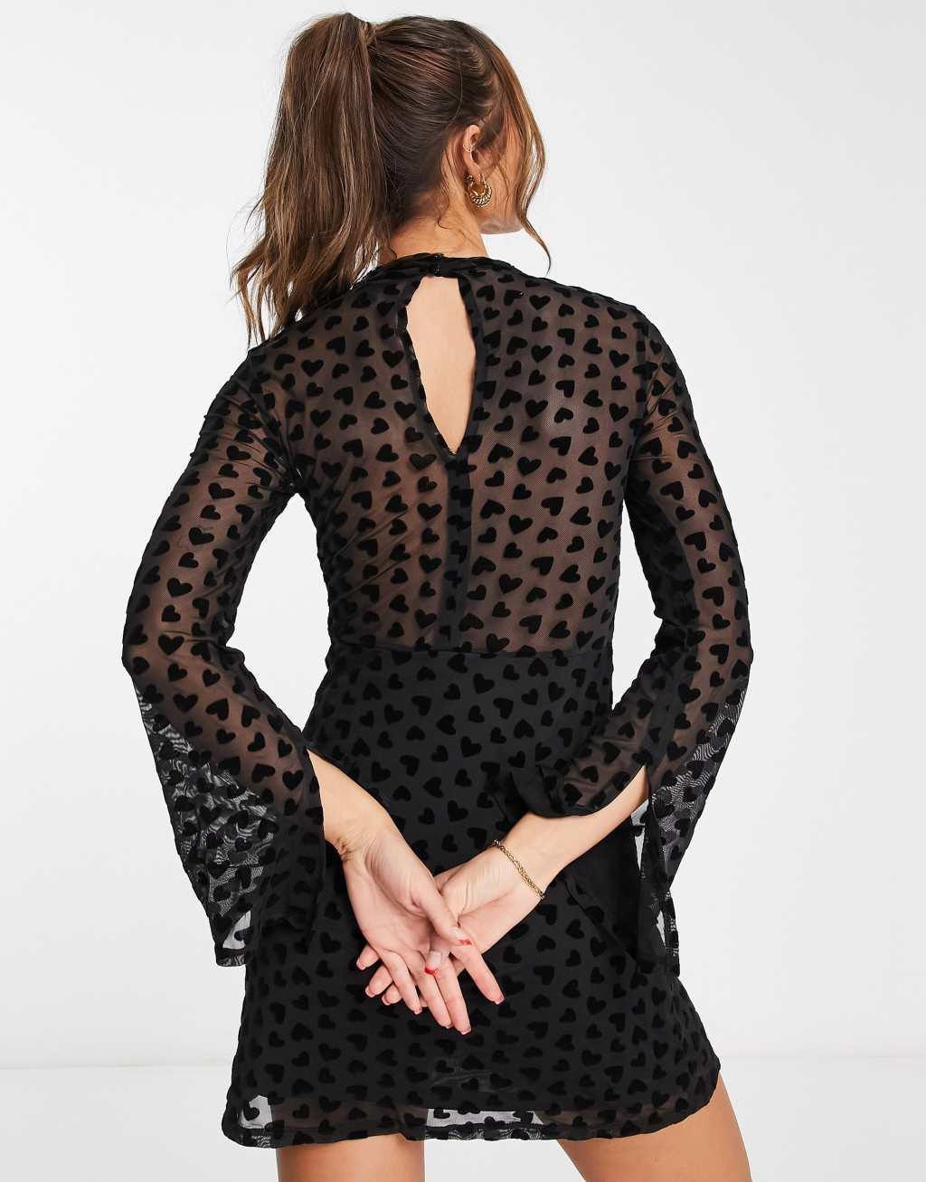 River Island heart mesh cut out mini dress in black devore Product Image