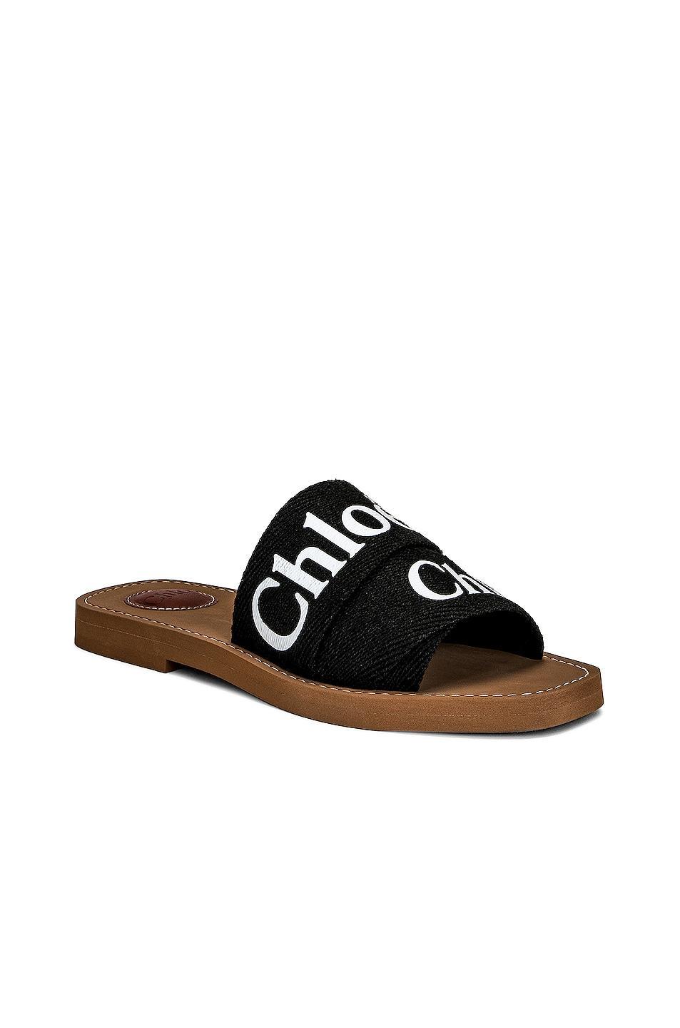 Chloe Woody Flat Slides in Black - Black. Size 41 (also in 35). Product Image