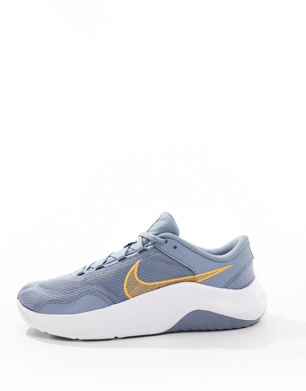 Nike Training Legend Essential 3 sneakers in gray and orange Product Image