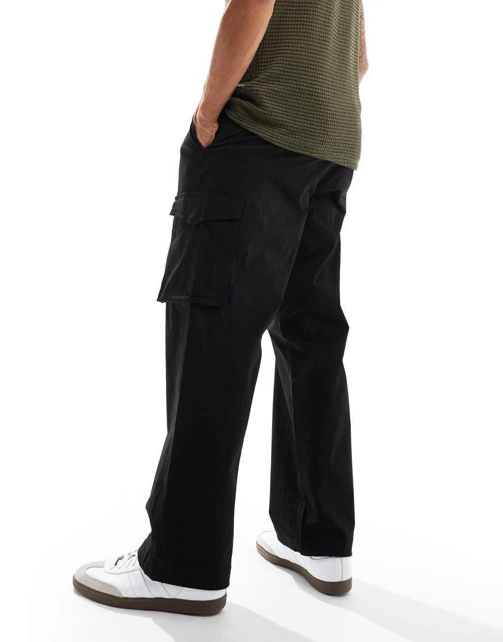 Jack & Jones bill drawstring wide fit tech cargo pants in black Product Image