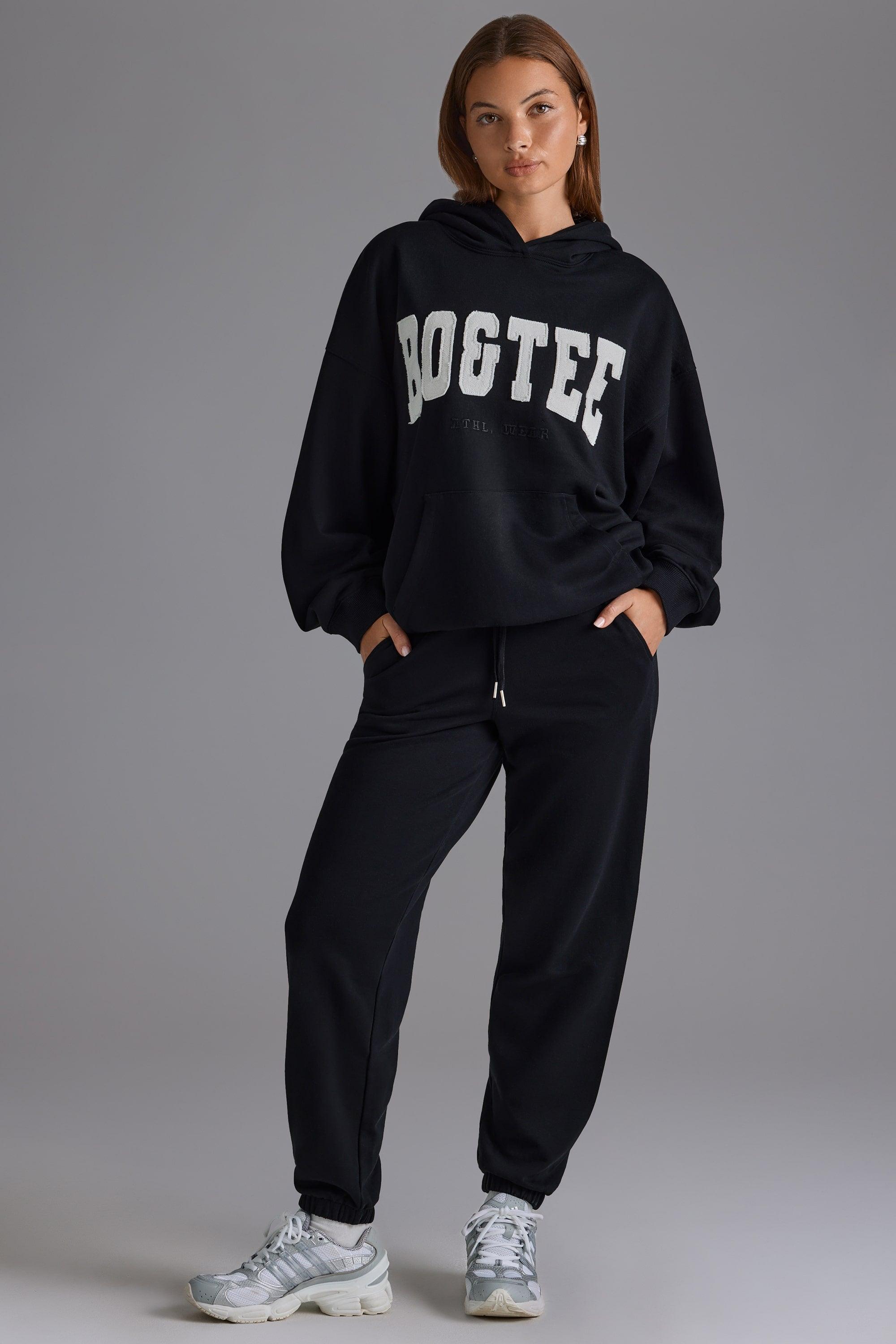 Petite Relaxed Mid-Rise Joggers in Black Product Image