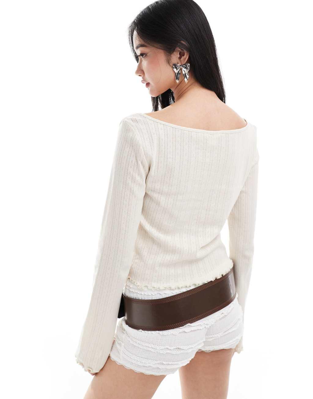 Monki pointelle long sleeve top with open neck in beige Product Image