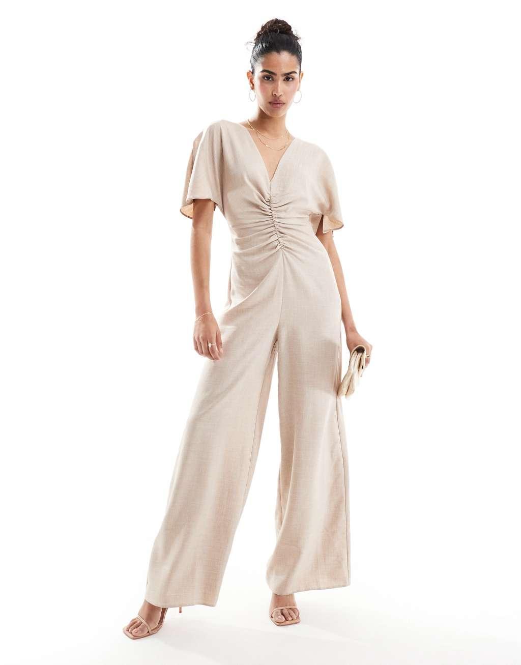 ASOS DESIGN ruched front cut out back jumpsuit in beige Product Image