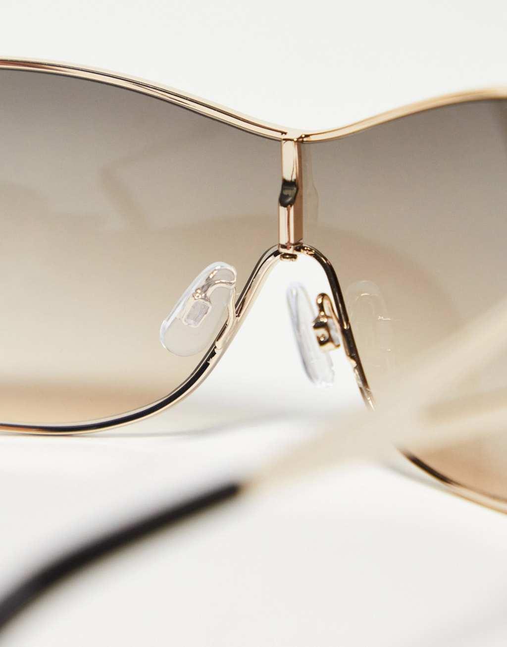 ASOS DESIGN oversized 90s wrap sunglasses with temple detail in gold Product Image