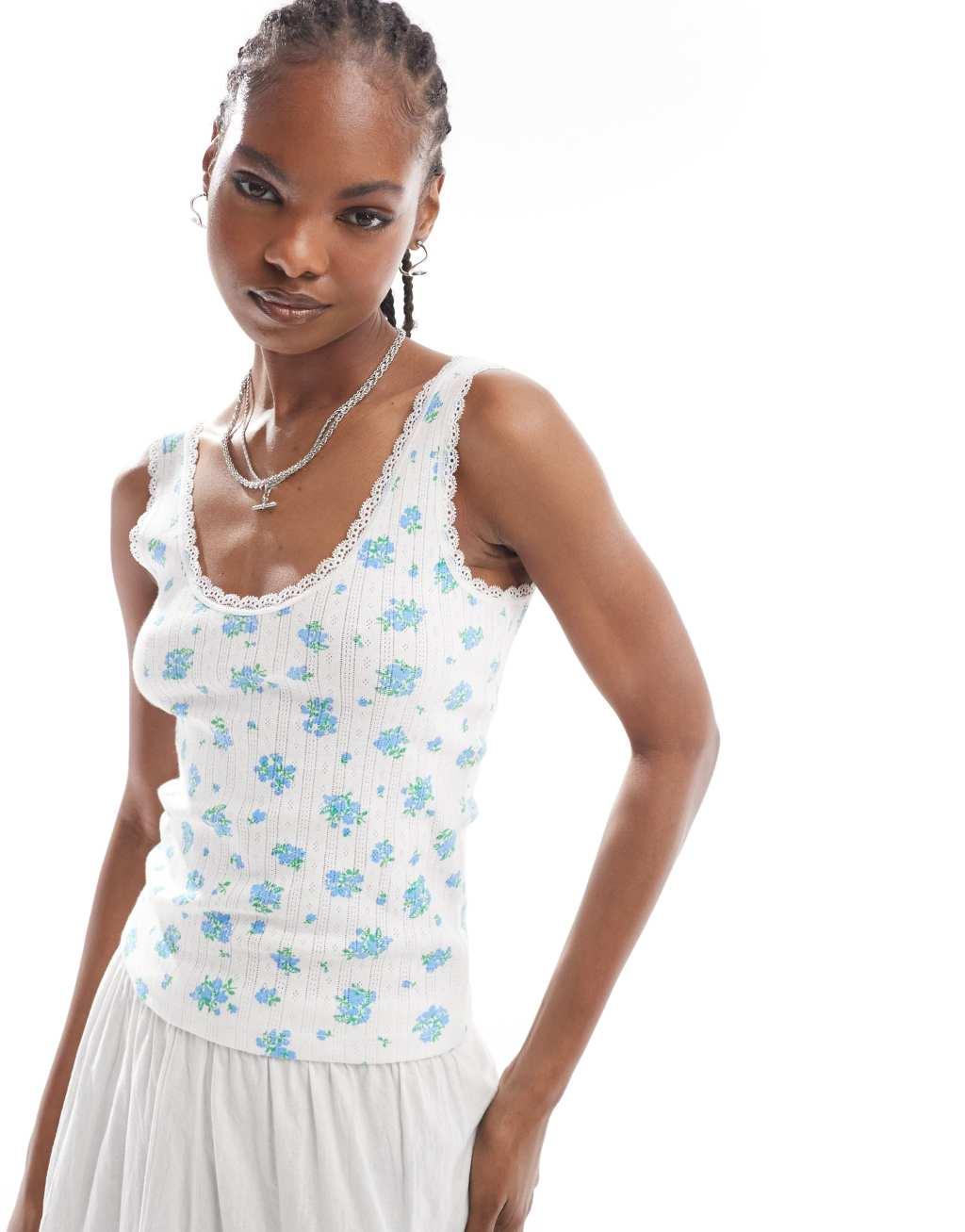 Monki pointelle scoop neck tank top with lace trim in off white and blue floral print Product Image