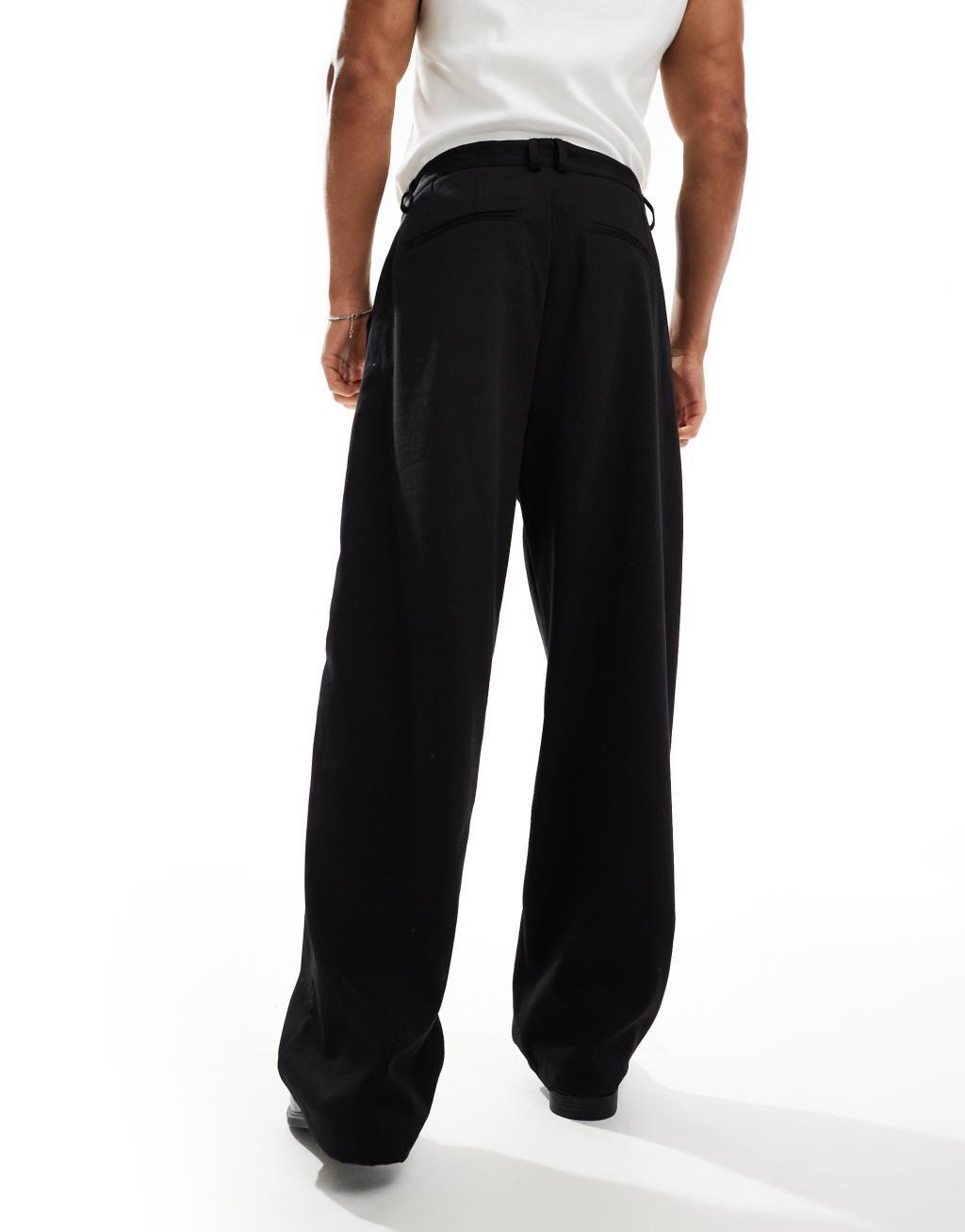 Bershka baggy tailored pants in black Product Image