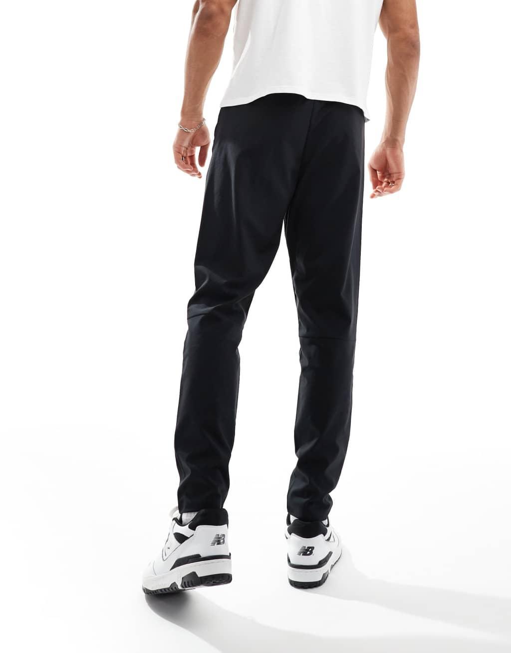 New Balance sport AC tapered track pants in black Product Image