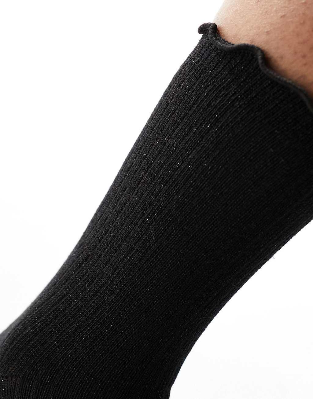 Vero Moda ribbed glitter sock with frill edge in black Product Image