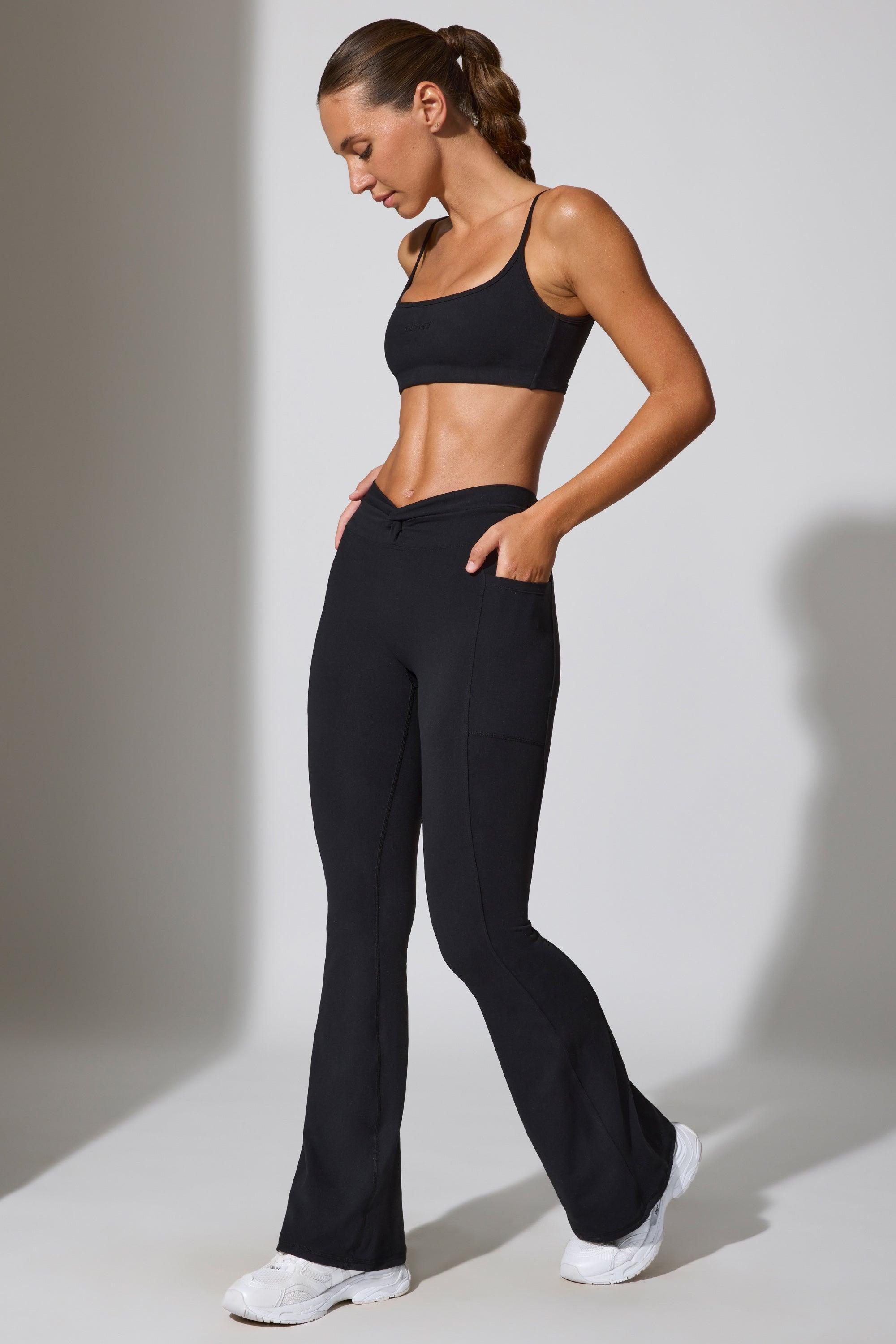 Twist Waist Flare Leggings in Black Product Image