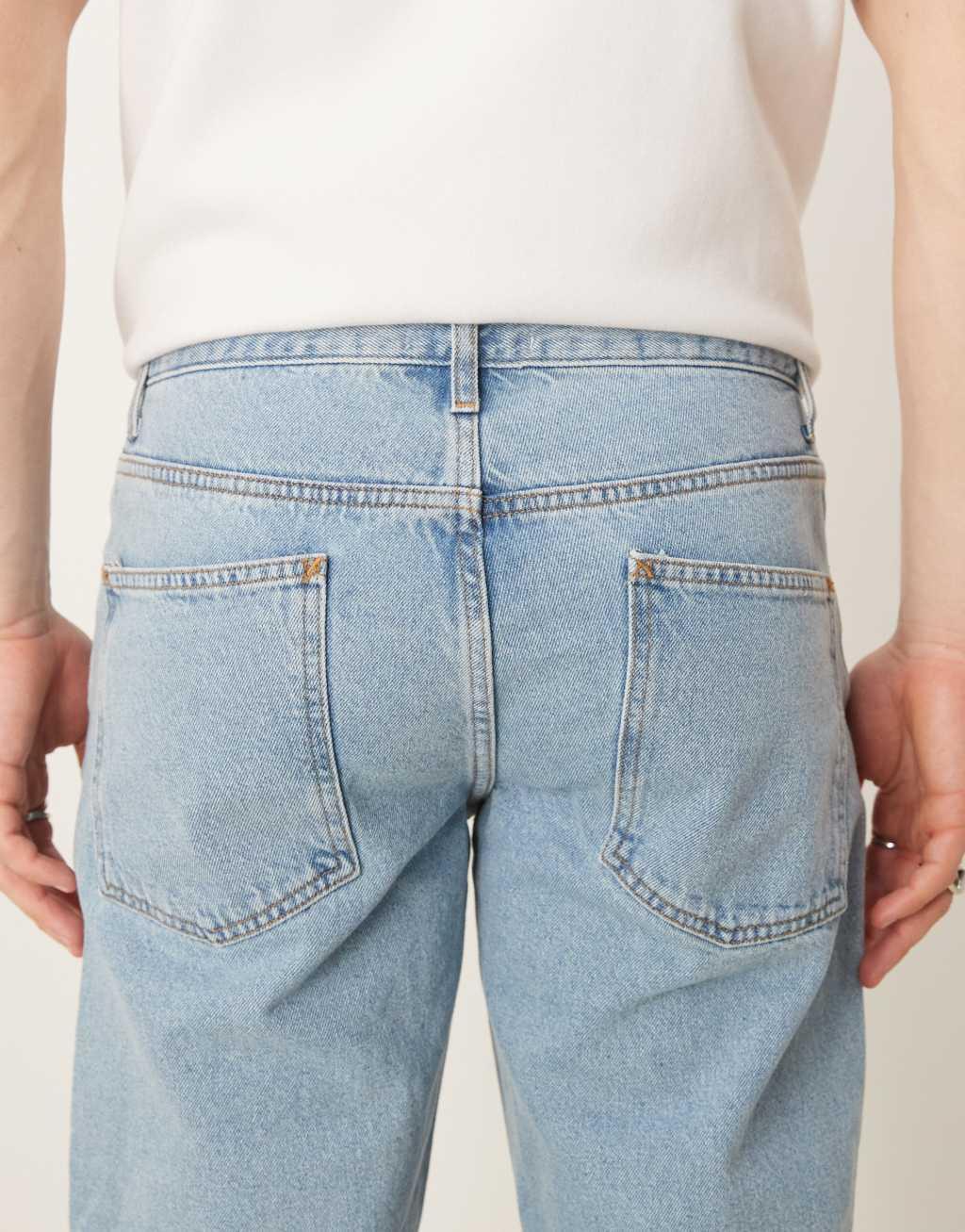 ASOS DESIGN tapered fit jeans in mid wash blue   Product Image