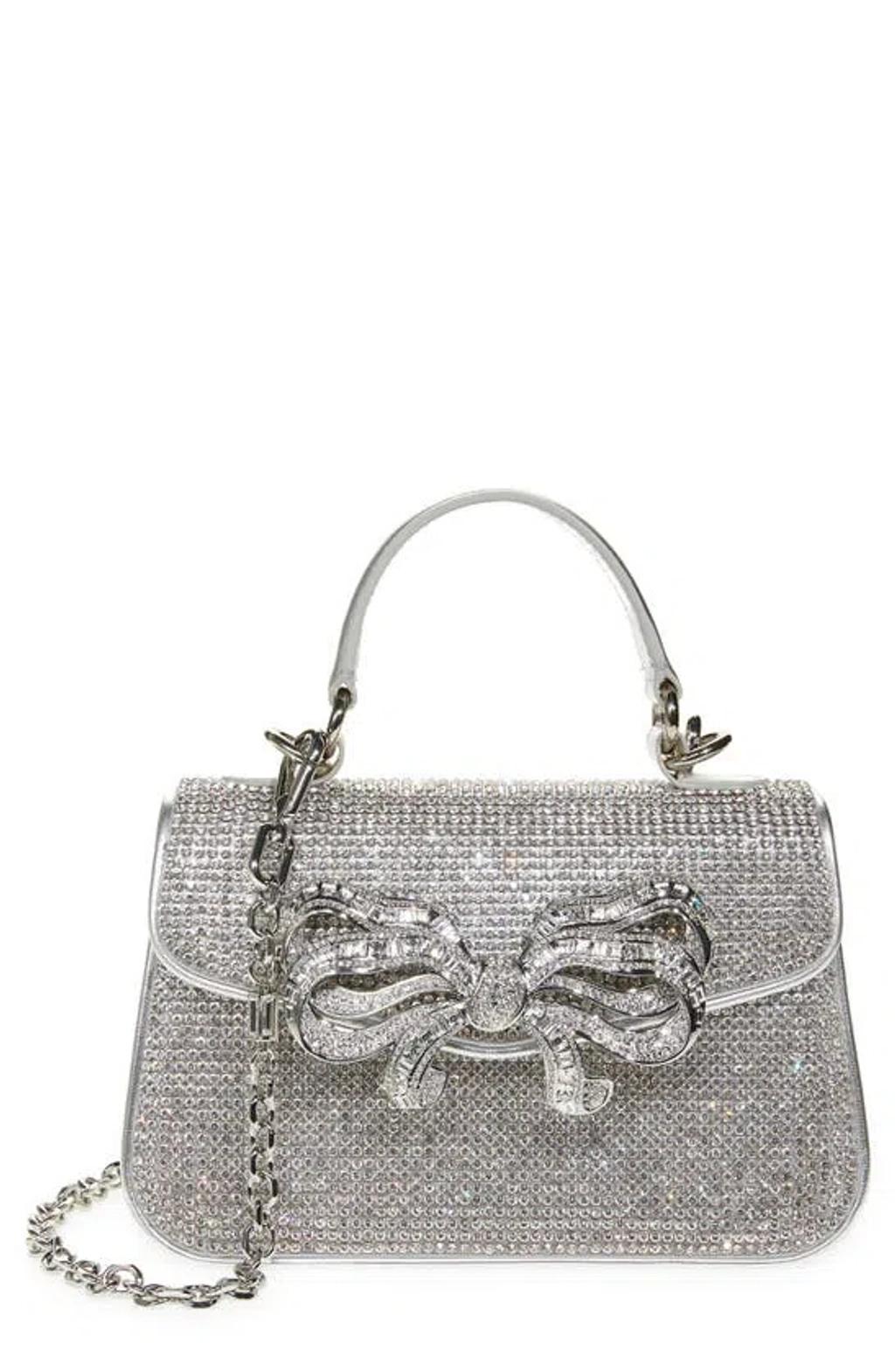 JUDITH LEIBER Mini Crystal-embellished Bow-detailed Metallic Leather Tote In Shine Silver Rhine Product Image