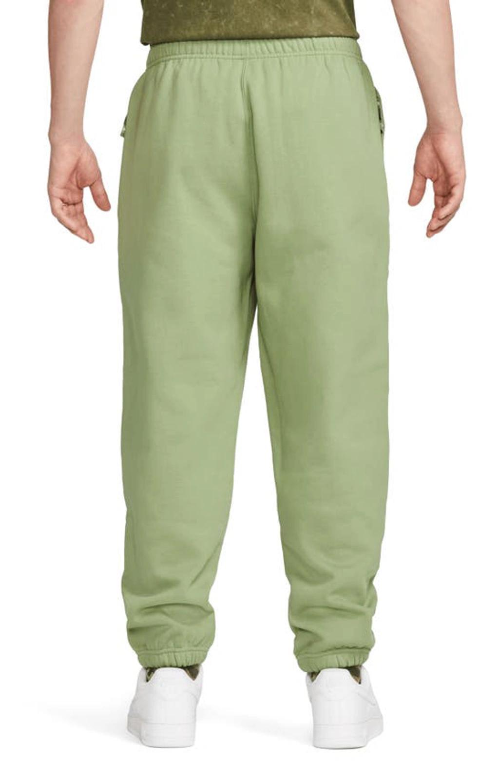 Solo Swoosh Woven Track Pants Green Product Image