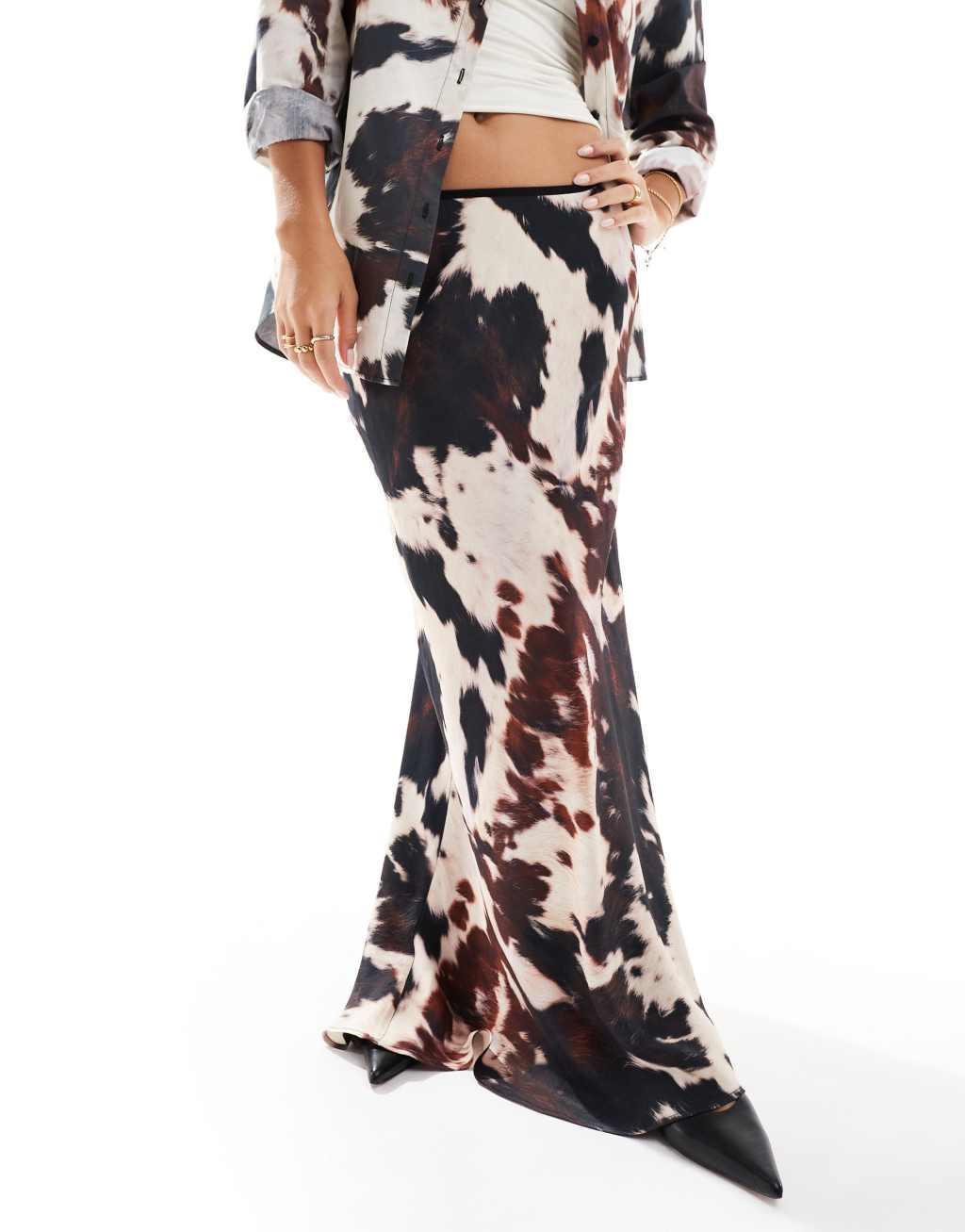 ASOS DESIGN satin bias maxi skirt in cow print Product Image