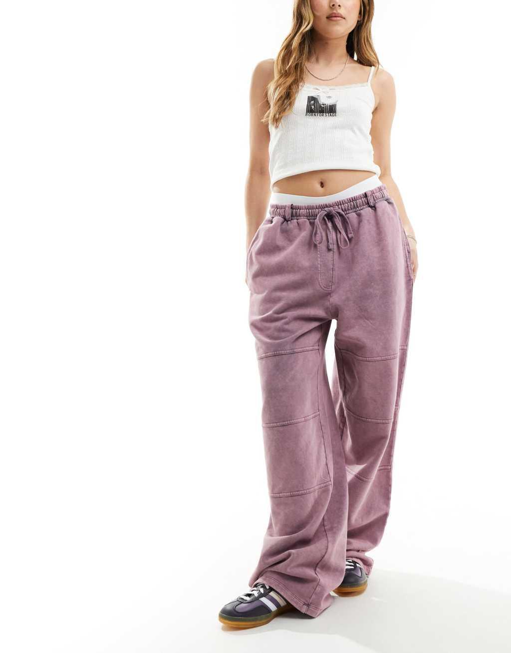 ASOS DESIGN straight leg sweatpants with seam details in pink acid wash Product Image