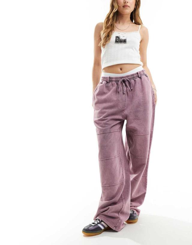 ASOS DESIGN straight leg sweatpants with seam details in pink acid wash Product Image