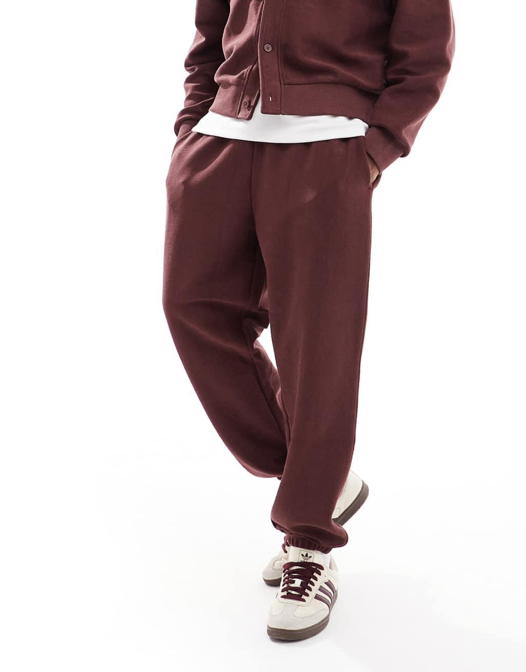 ASOS DESIGN oversized textured sweatpants in burgundy Product Image