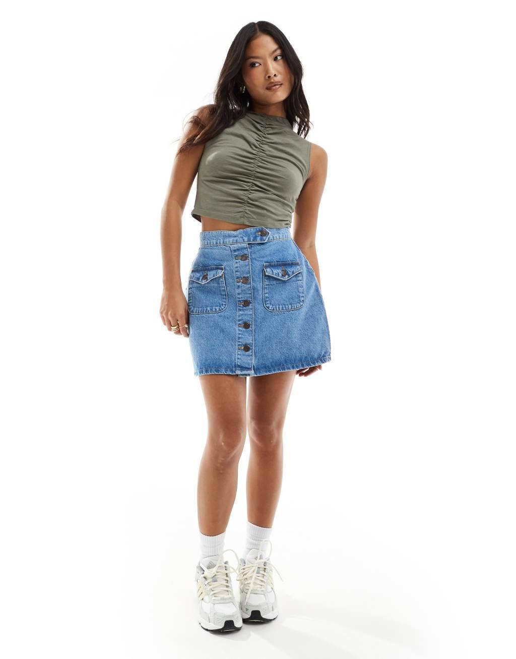 ASOS DESIGN Petite denim button up mini skirt in mid wash blue Product Image