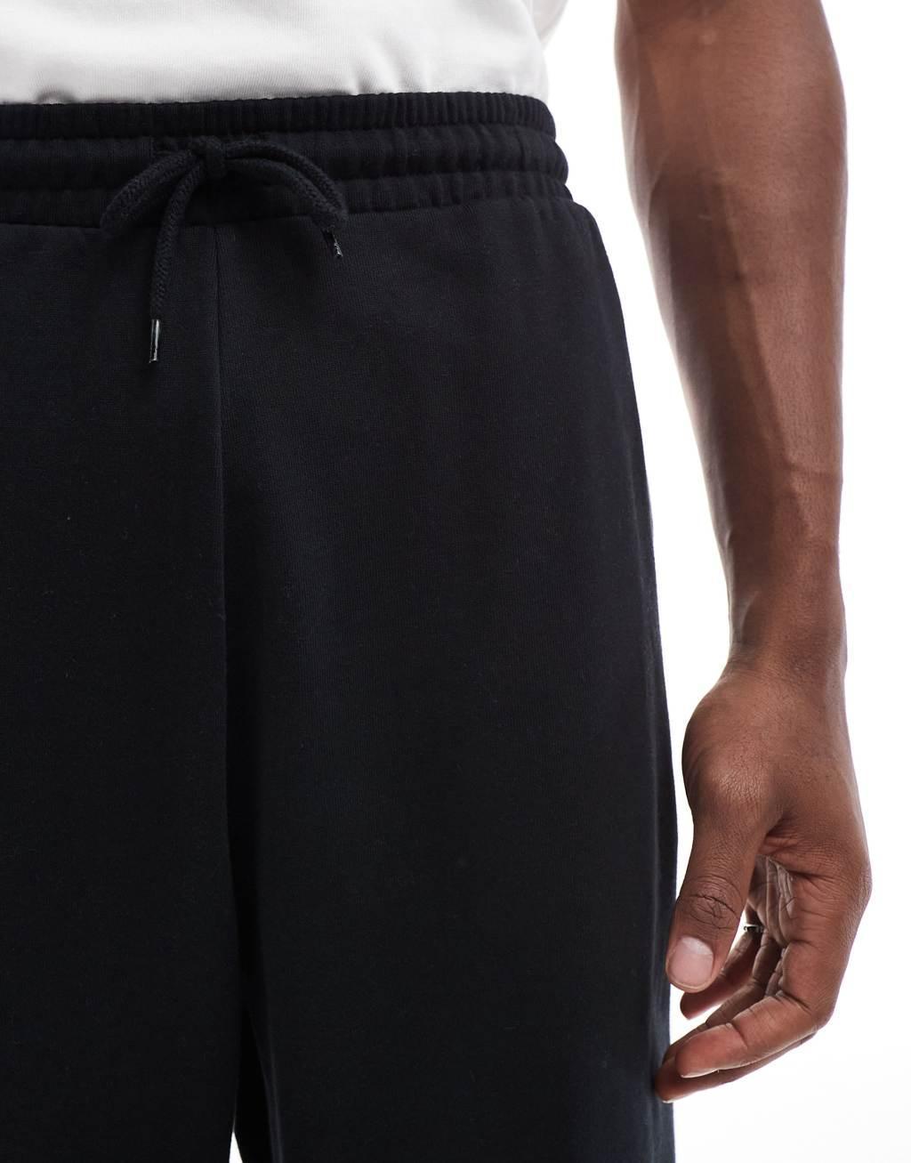 ASOS DESIGN oversized sweatpants in black Product Image