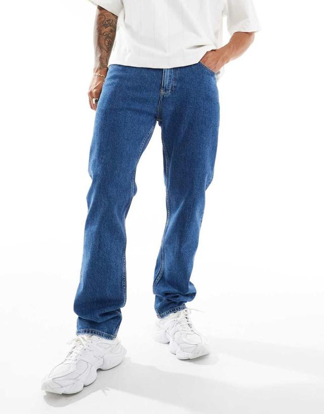 Tommy Jeans Ryan regular straight jeans in mid wash with flag detail Product Image