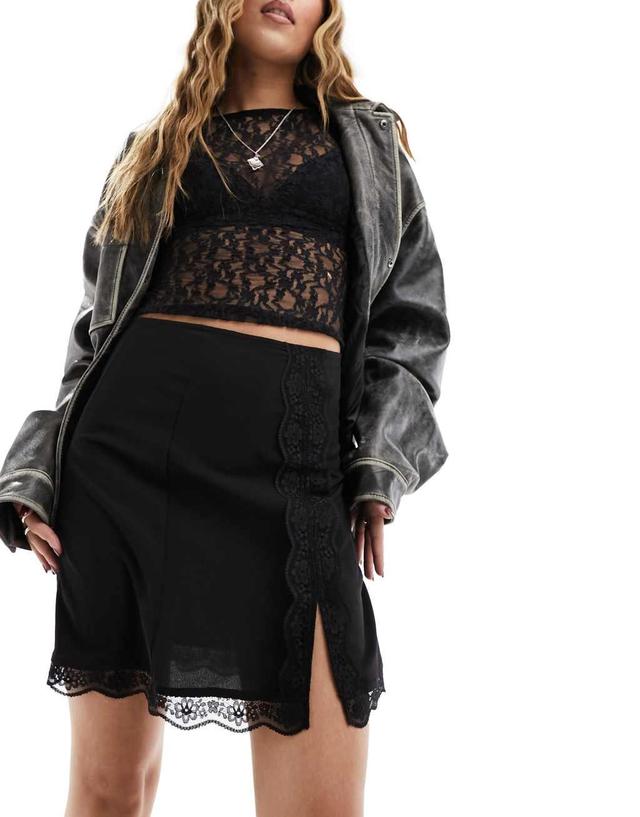 Monki lace trim mini skirt with thigh split in black Product Image