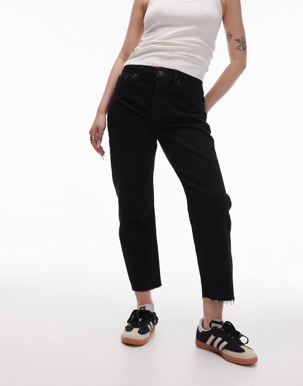 Topshop Petite cropped mid rise straight jeans with raw hems in black Product Image