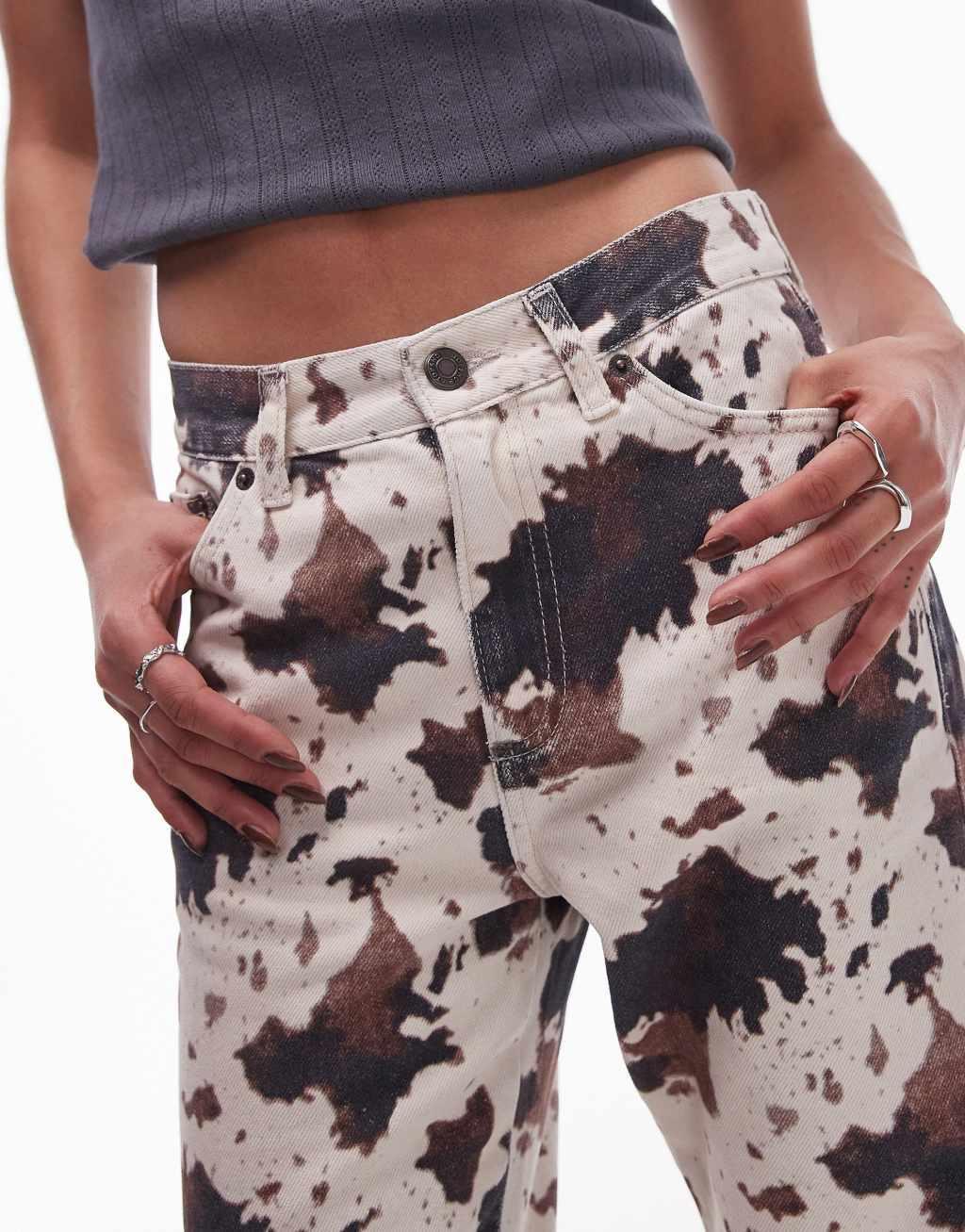 Topshop mid rise 90s flare jeans in cow print Product Image