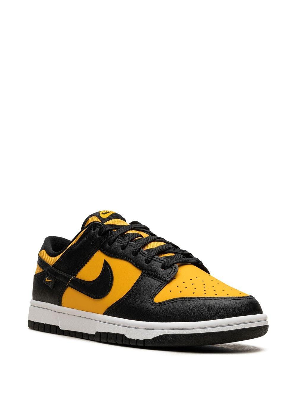 Dunk Low "black/university Gold" Sneakers In White Product Image