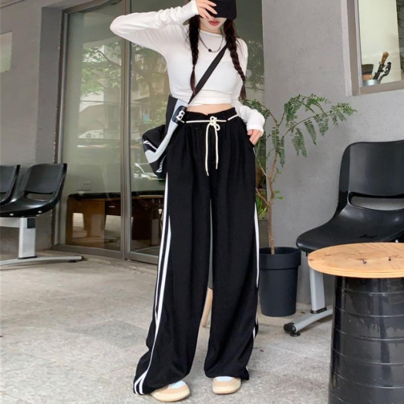 Long-Sleeve Round Neck Plain Cutout Crop Tee / Drawstring Waist Striped Wide Leg Sweatpants Product Image