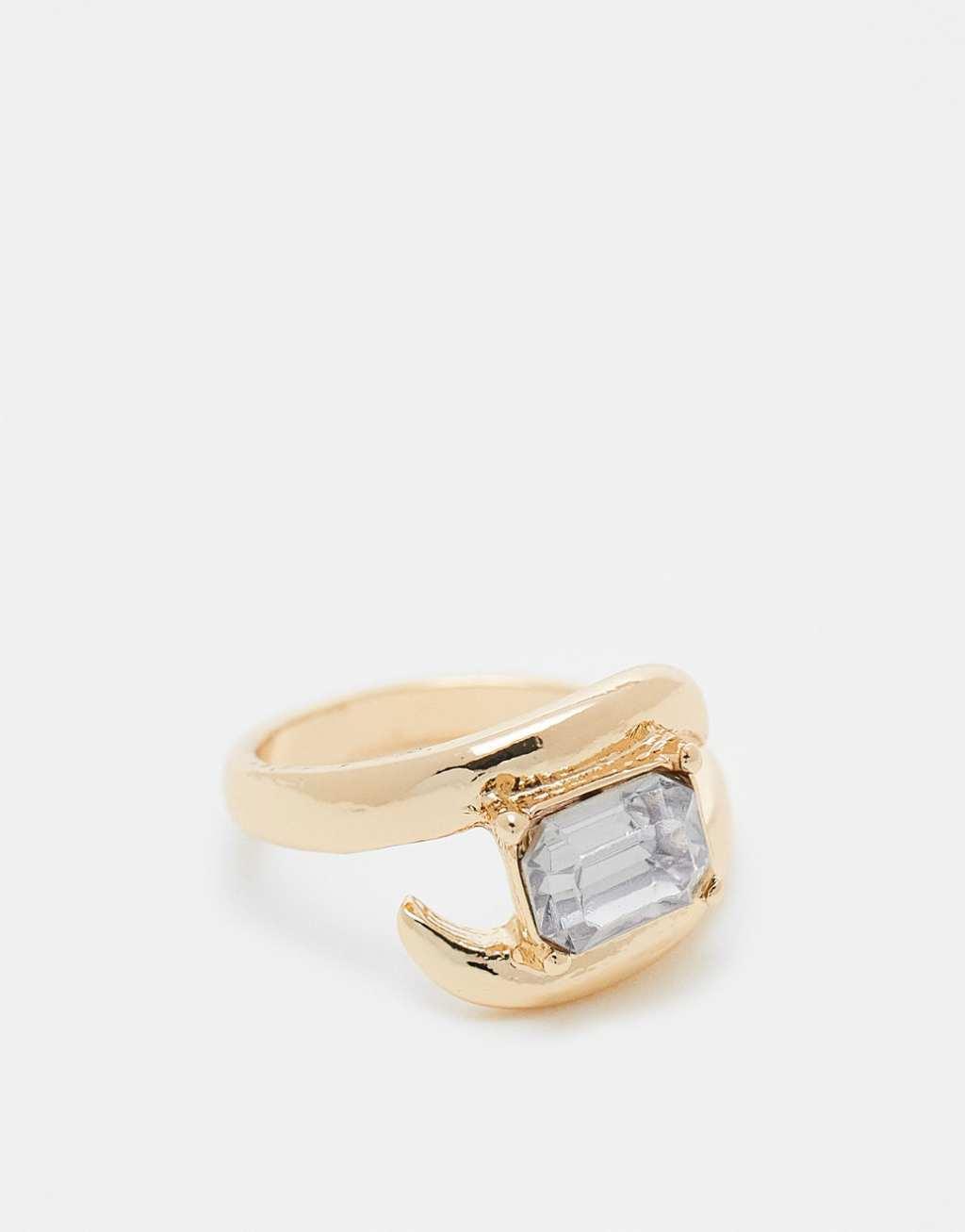 ASOS DESIGN ring with wrap around crystal detail in gold tone Product Image