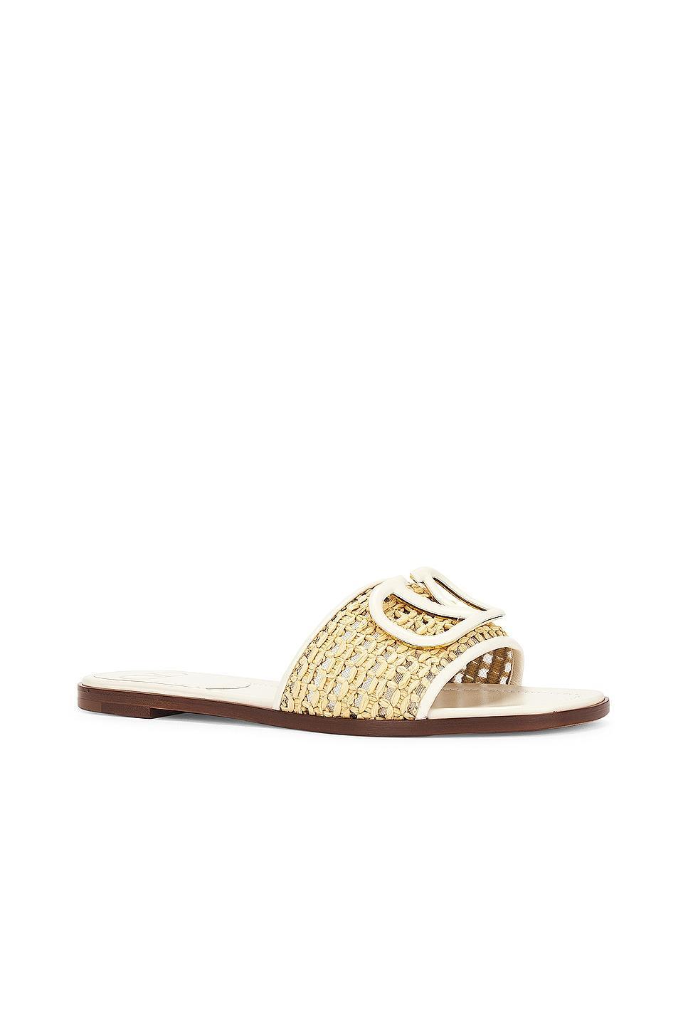 Valentino Garavani V Logo Signature Slide in Naturale & Light Ivory - Ivory. Size 38.5 (also in 36.5, 39, 39.5, 40). Product Image